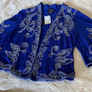 Comfy new topper jacket. Approx 22" length. 36" arm to arm. 15" bell sleeve